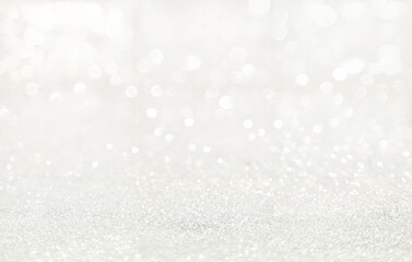 Bright white glitter texture with dreamy bokeh lights and soft sparkling glow. Perfect for festive designs, luxury branding, elegant holiday cards, and celebration backgrounds.