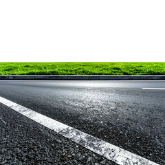 Low angle perspective on an asphalt road bordered by lush green grass, black sky