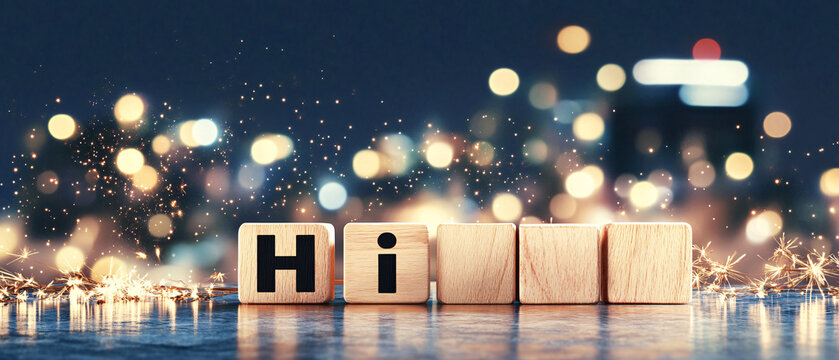 Festive greeting with wooden blocks spelling Hi and sparkling lights at night Concept of celebration, holiday, and welcome message with bokeh background