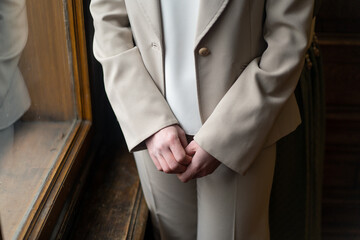 Clasped female hands close up.