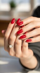 Elegant Red Manicure - Close-Up of Hands with Polished Nails.