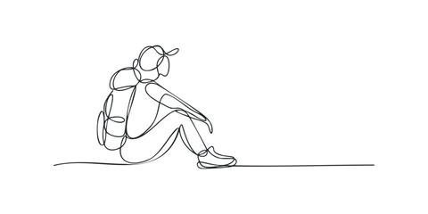 Person with backpack resting after journey