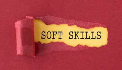 A torn piece of paper with the word Soft Skills written on it