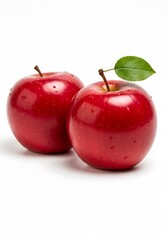 Two Ripe Red Apples with a Green Leaf on a White Background.