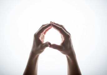Hands Forming a Heart Shape Against White Background Symbolizing Love