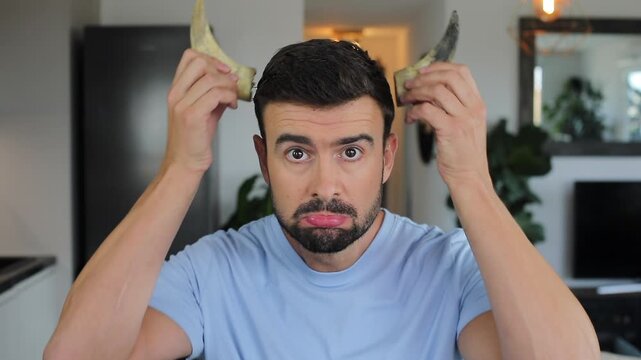 Man with pair of growing horns 