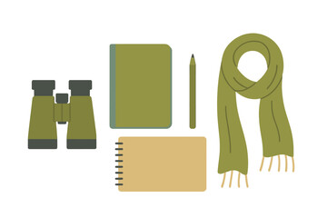 Flat lay of outdoor travel essentials including binoculars, notebooks, pencil, and warm scarf