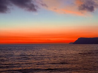 tender purple and orange gradient sky at the sea, sunset sea horizon, natural colors