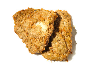 Fine breaded chicken breast fillet on white background. Classic poultry product. Uncooked meat covered with golden breadcrumbs.
