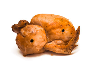 A whole chicken is sitting on a white background. The chicken is brown and has a crispy skin. Popular poultry product cooked to top standard. Food industry.