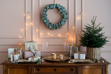 Elegant Christmas Display Featuring Gifts, Wreath, and Festive Decorations