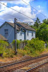 Fototapeta premium cottage next to railway line