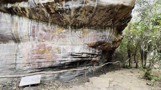 indigenous aboriginal rock art paintings at an ancient rocky outcrop along a hiking trail of Ubirr heritage site in Kakadu National Park, Arnhemland, Northern Territory, Australia.