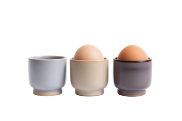 Three egg cups with two eggs in them. Isolated on transparent background, png