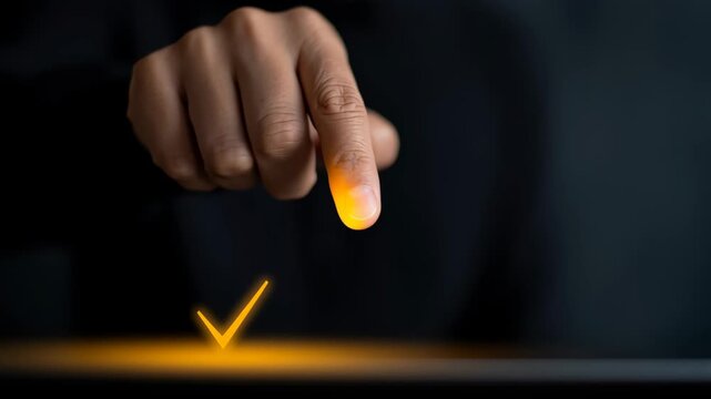 Hand pressing a glowing check mark, symbolizing approval and digital interaction in modern technology