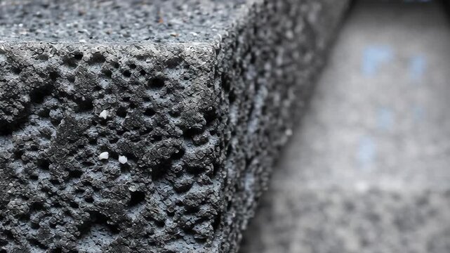 Close-up of textured volcanic rock showcasing unique geological features and rich textures