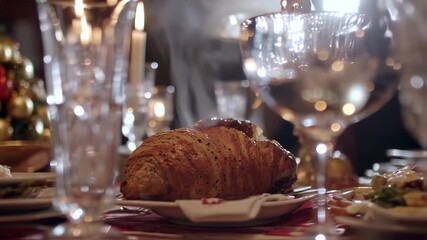 Elegant Dining Table with Croissant and Wine Glasses in a Restaurant.