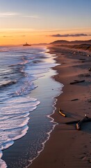 Golden Hour Serenity - Waves Washing Ashore on a Sandy Beach.