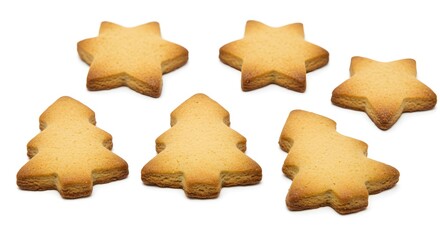 An assortment of festive-shaped cookies perfect for the holiday season, shaped like stars and trees. They have a golden-brown color and a delightful, tempting appearance.