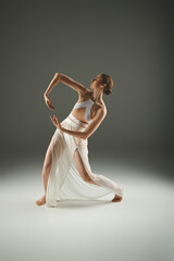 Fototapeta premium Elegant ballet dancer showcases grace and artistry in a stunning performance