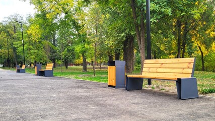 Modern Benches and Bins in an Autumn Park