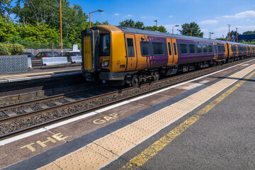 Fototapeta premium passenger urban commuter rural railway station england uk
