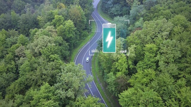 Aerial of white electric car on eco forest road with animated battery level. 3D graphic