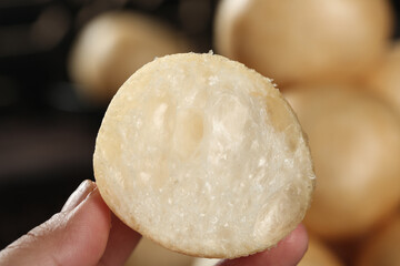 Hand Holding Fresh Steamed Dumpling Showing Soft White Interior Texture Asian Cuisine Food