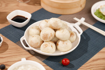 Chinese Steamed Buns Bao Dumplings with Soy Sauce Traditional Asian Food Breakfast Gourmet Cuisine
