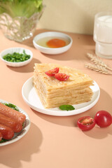 Handmade Thin Layered Pancakes Stack with Tomatoes and Sausages on Wooden Table - Homemade Breakfast Pastry Food Photography