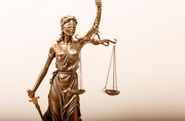 Obraz premium Lady Justice, a classical representation of justice, holding scales and sword. Depicts fairness, law, and the legal system, set against a neutra