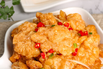Golden Crispy Pork with Red Chili Peppers - Traditional Northeast Asian Cuisine in White Bowl