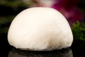 Soft White Steamed Bun Dumpling Traditional Asian Dim Sum Food on Dark Surface