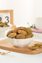 Chaoshan Candied Licorice Olives - Traditional Chinese Dried Fruit Snack in White Bowl