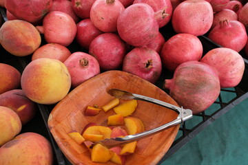 A vibrant pile of pinkish-red pomegranates