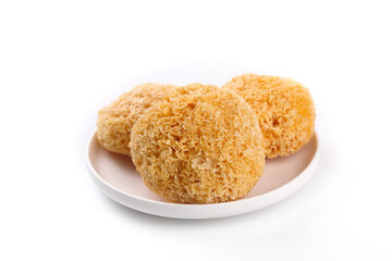 Dried White Tremella Silver Ear Mushrooms on Plate - Traditional Chinese Medicinal Fungus Ingredient