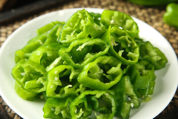 Fresh Green Tiger Peppers Sliced on White Plate - Healthy Vegetable Ingredient for Asian Cooking