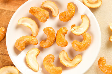 Crispy Deep Fried Cashew Nuts and Fresh Kernels on White Plate - Healthy Snack Treats