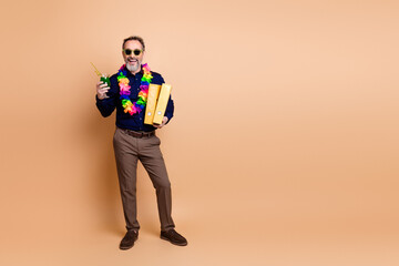 Cheerful businessman with a tropical vibe, holding folders and enjoying a refreshing drink,...