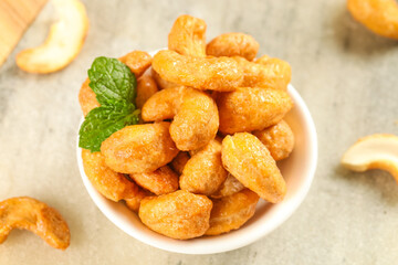 Salted Cashews in Bowl with Mint Garnish - Crispy Roasted Nuts Snack Food Photography