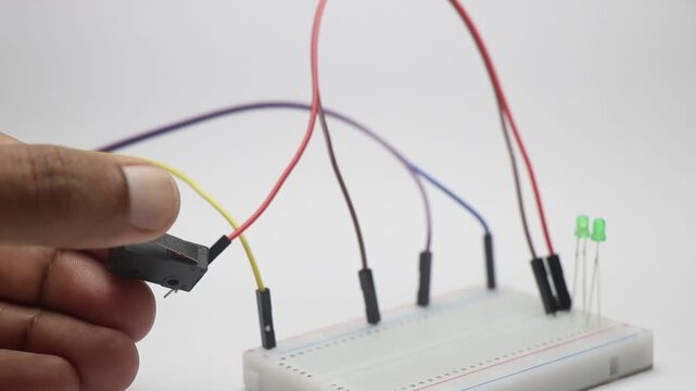 Limit switch is used to control the on and off of a green color LED. Simple on and off electronic circuit on a breadboard