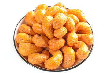 Deep Fried Salted Cashew Nuts in Bowl - Crunchy Amber Golden Snack Food