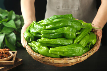 Fresh Green Chili Peppers in Wicker Basket - Home Cooking Ingredients
