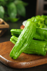 Fresh Green Peppers on Wooden Cutting Board - Healthy Cooking Ingredients