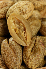 Dried Peanuts in Shells Close-up with Cracked Open Nut Showing Natural Texture