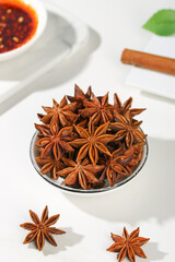 Star Anise Spice Collection - Whole Dried Seeds in Bowl with Five Pointed Star Characteristics Display