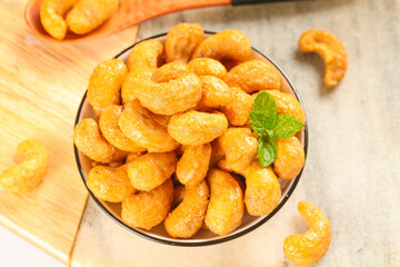 Vietnamese Salt-Baked Crispy Cashew Nuts in Bowl with Mint Garnish - Healthy Snack Food Gift