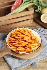 Spicy Pickled Chicken Feet Asian Delicacy with Fresh Lemon and Vegetables on Wooden Table