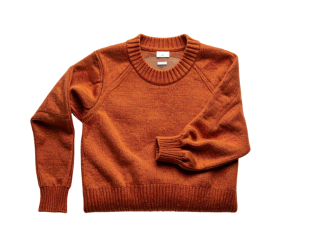 Folded rust-colored sweater