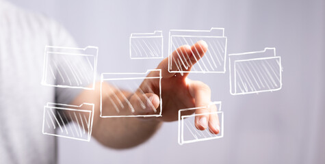 Hand touching virtual folders representing digital data, cloud storage, and information technology....
